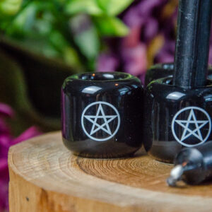 Black chime candle with white pentagram imprint @dreaminggodess.com